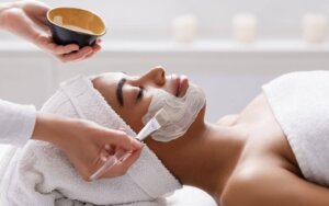 woman getting facial at skin care clinic in Suffolk
